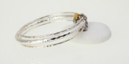 Three Recycled Silver hammered Bangles Connected with a Oxidised abstract disc
